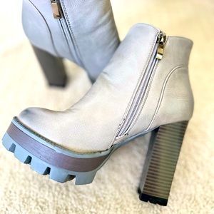 Grey boots, high heels 4.5 inches.